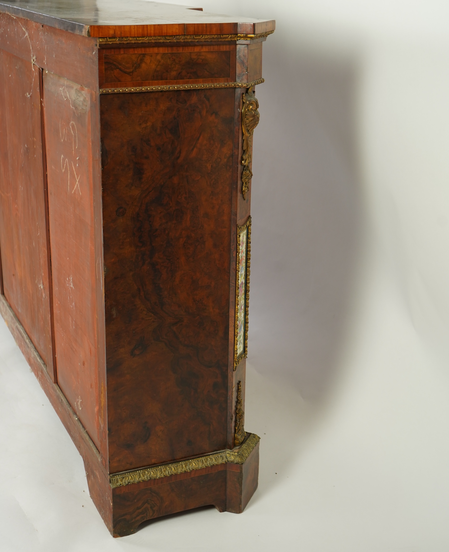 A Victorian tulip banded and gilt metal mounted walnut breakfront side cabinet